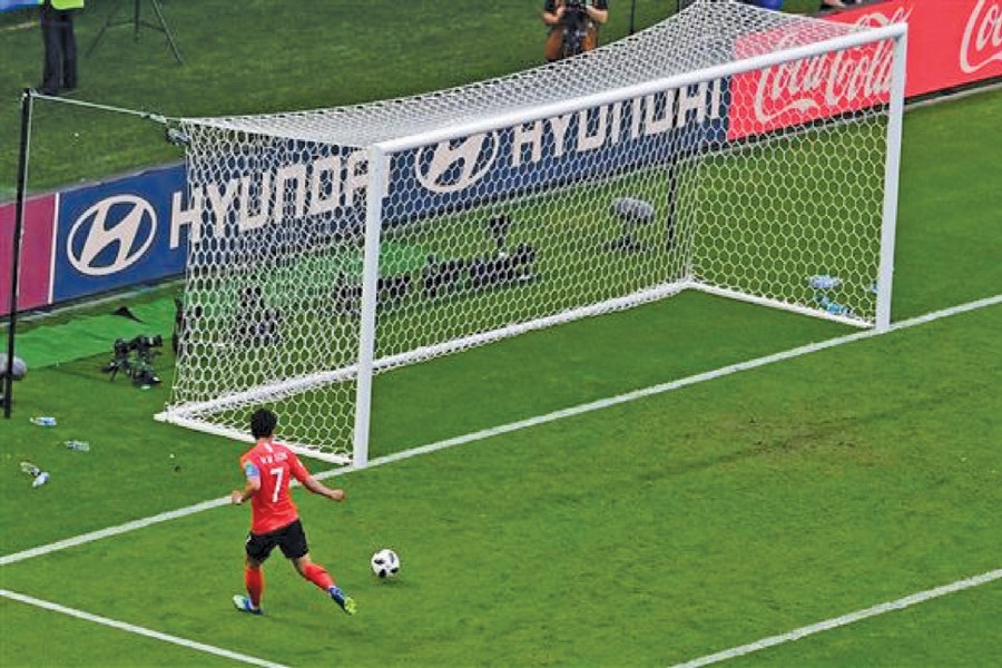 South Korea's forward Son Heung-min scores his team's second goal sending the ball in an empty net during Wednesday's 2018 FIFA World Cup match in Kazan against reigning champions Germany.