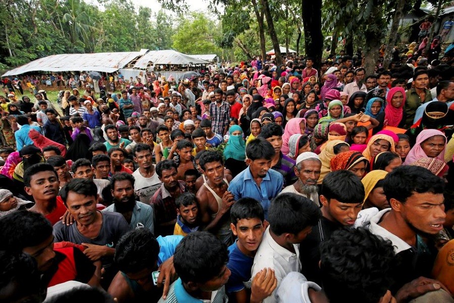 Rohingya refugees gather to collect relief at the Balukhali Makeshift Refugee Camp as they are affected by Cyclone Mora in Cox’s Bazar, Bangladesh, May 31, 2017. Reuters/File Photo