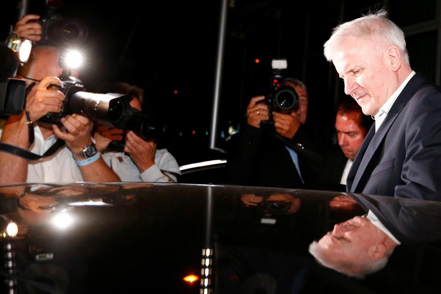 German Interior Minister Horst Seehofer leaves a Christian Social Union (CSU) leadership meeting in Munich, Germany July 2, 2018. Reuters.