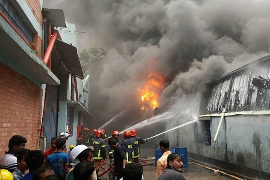 Fire fighters trying to bring the fire under control at a foam factory in Borobari area of Gazipur city on Tuesday