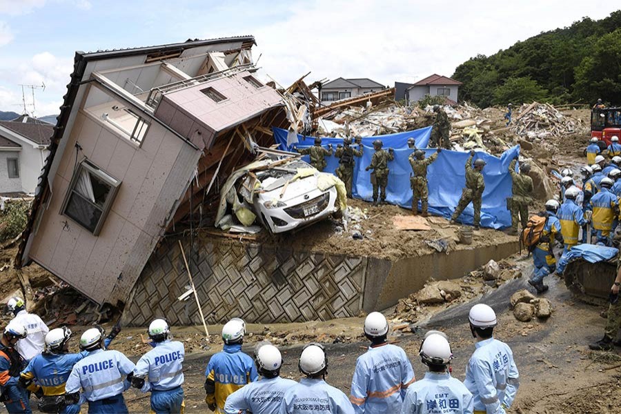 Rescuers conduct a search operation for missing persons in Kumano town, Hiroshima prefecture, western Japan on Monday - Reuters photo