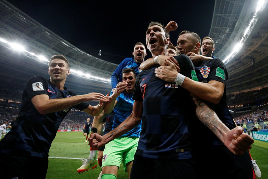 Croatia's Mario Mandzukic celebrates scoring the decisive goal with his teammates