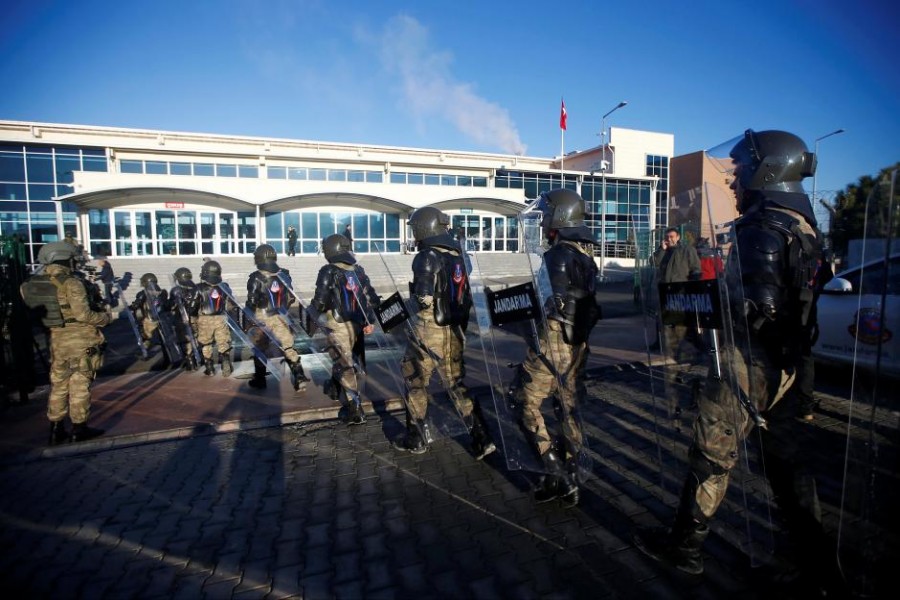 Turkish soldiers walk outside the Silivri Prison and Courthouse complex during the first trial related to Turkey’s failed coup, in Istanbul, Turkey, December 27, 2016 – Reuters