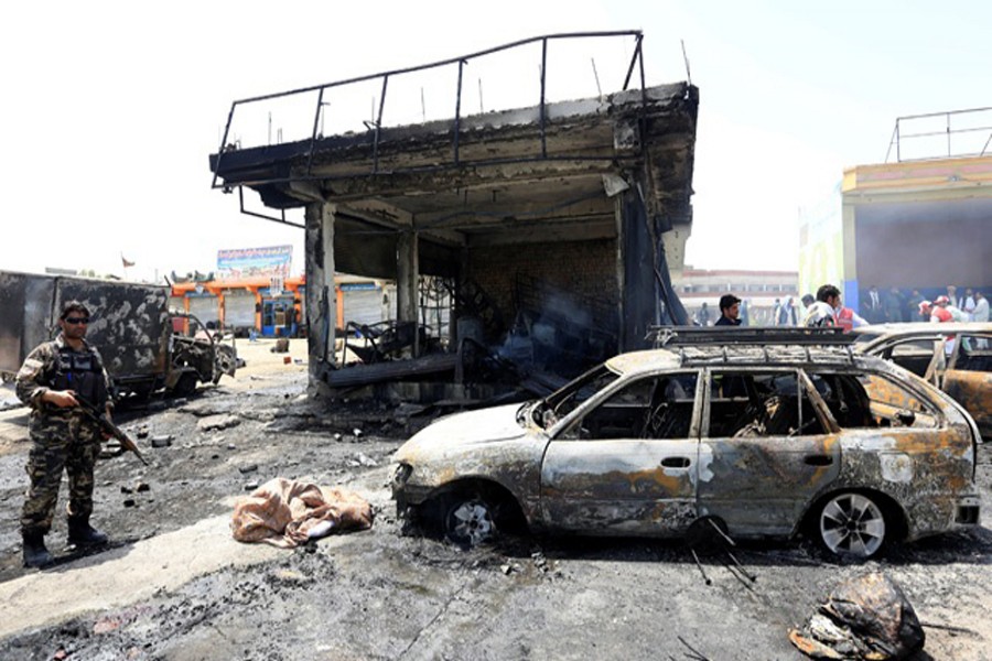 Afghan security forces inspecting the site of a suicide attack at Jalalabad city in Afghanistan recently	—  Reuters