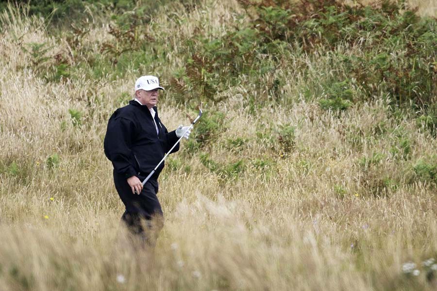 US President Donald Trump plays golf at Turnberry golf club, Scotland, Saturday, July 14, 2018. Trump spent the weekend at his sea-side Trump Turnberry golf resort in Scotland, where aides had said he would be busy preparing for his Monday summit in Helsinki, Finland. —AP Photo