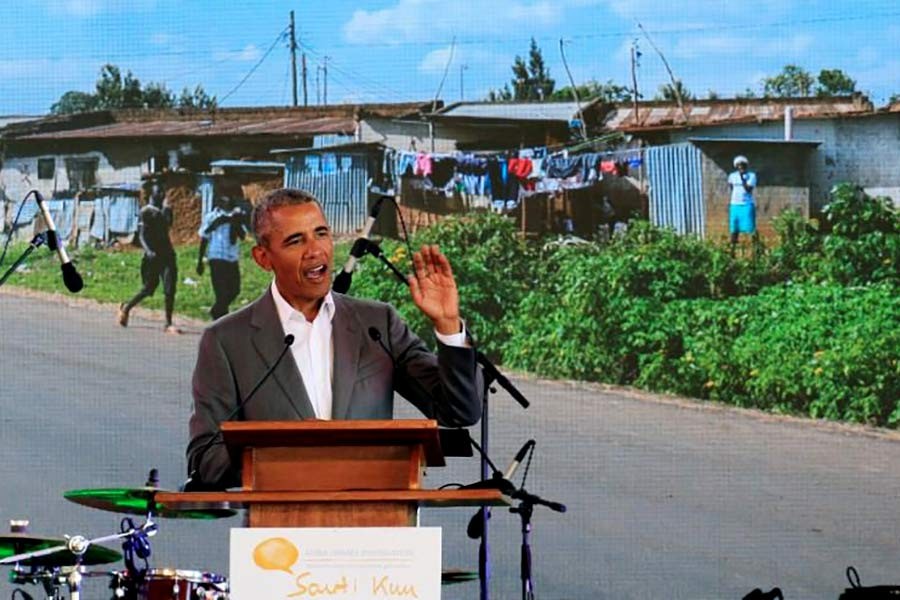 Former US President Barack Obama addressing delegates during the launch of Sauti Kuu resource centre near his ancestral home in Nyangoma Kogelo village in Siaya county of Kenya on Monday. -Reuters Photo