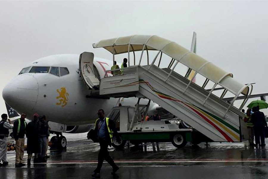 Ethiopian Airlines staff preparing their plane as they resume flights to Eritrea's capital Asmara at the Bole International Airport in Addis Ababa of Ethiopia on Wednesday. -Reuters Photo