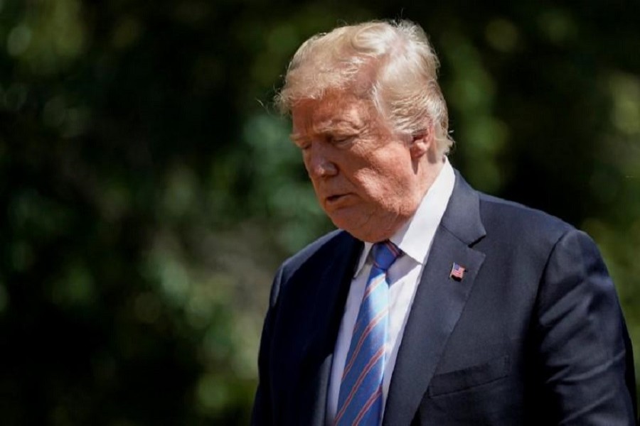 US President Donald Trump walks from Marine One as he arrives on the South Lawn of the White House in Washington, US, July 18, 2018. Reuters