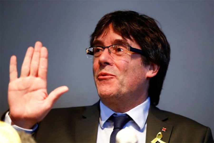 Spain drops arrest warrant for former Catalan leader