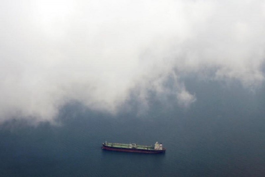 A tanker travels through the Singapore Strait July 7, 2014. Reuters/File Photo