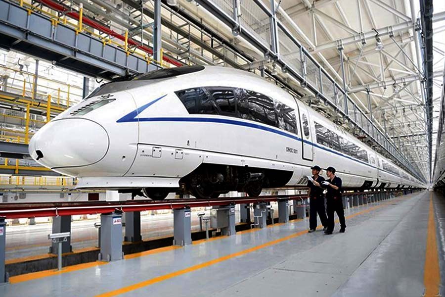 Machinists walk at the Chongqing West bullet train application in Chongqing, southwest China on Wednesday, July 18, 2018. The Chongqing West bullet train application was put into official use on that day. — Xinhua