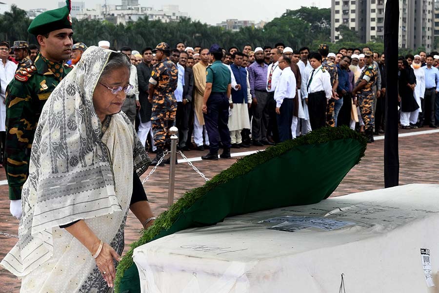 Prime Minister Sheikh Hasina placing wreaths on the coffin of lawmaker SM Mostafa Rashidi Suja at the South Plaza of Jatiya Sangsad Bhaban on Sunday. -Focus Bangla Photo