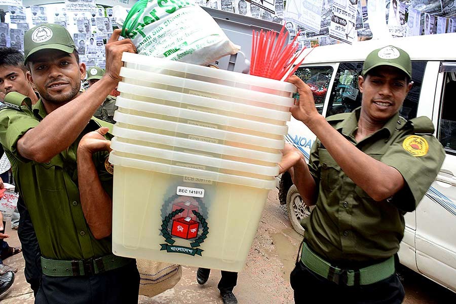 Ballot boxes being taken to the polling stations from the returning officer's office in Rajshahi on Sunday. -Focus Bangla Photo