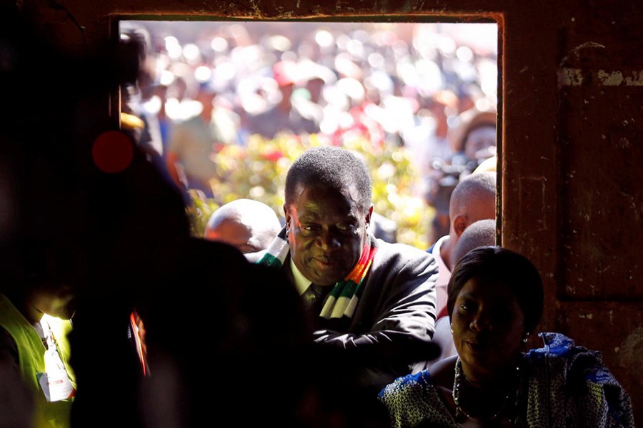 Zimbabwe's President Emmerson Mnangagwa arrives to vote in the general election at Sherwood Park Primary School in Kwekwe, Zimbabwe on Monday — Reuters