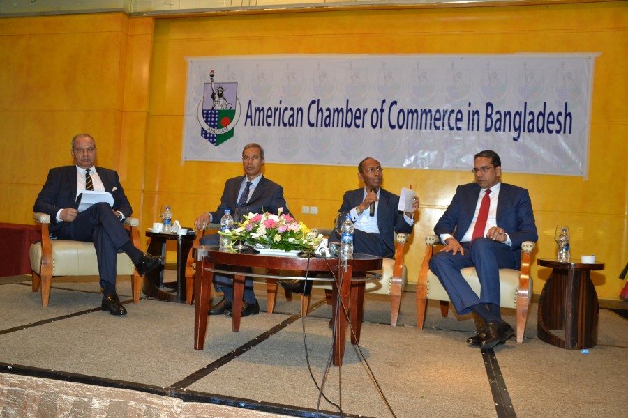 Executive Chairman of BIDA Kazi M Aminul Islam (2nd from right) addressing the AmCham meeting on Tuesday