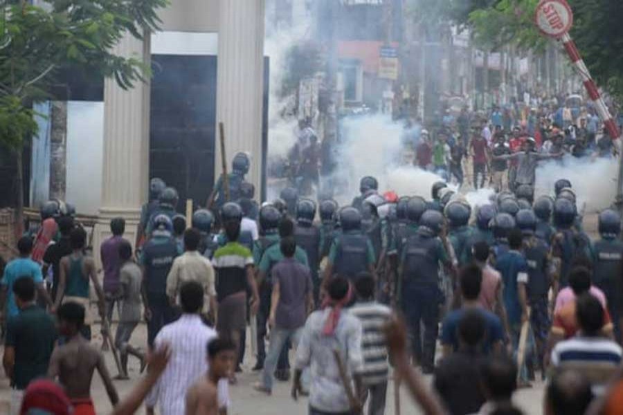 Cops fire tear gas shells on protesting East West university students on Monday. Photo: UNB