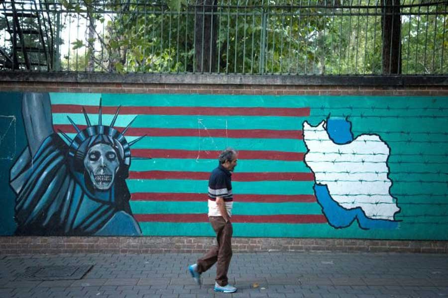 A man walks past an anti-US mural in Tehran, Iran October 13, 2017. Reuters/Files