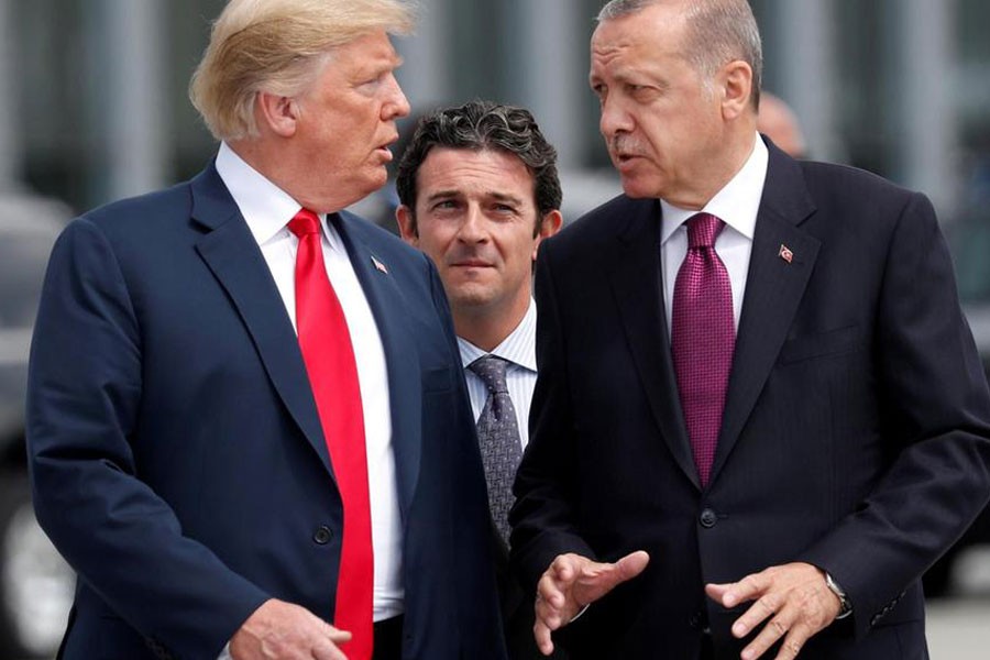 Donald Trump and Recep Tayyip Erdogan gesture as they talk at the start of the Nato Summit in Brussels in July - Reuters