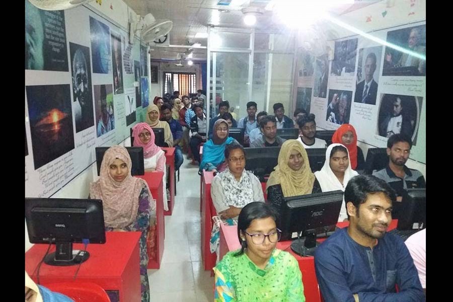 Students attend an outsourcing seminar in Rajshahi. Image derived from Youtube