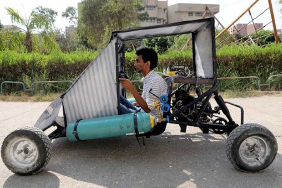 Mahmoud Yasser, mechanical engineering student from Helwan University, drives the air-powered vehicle which he helped design to promote clean energy and battle increasing gas prices, in Cairo, Egypt August 7, 2018. Reuters