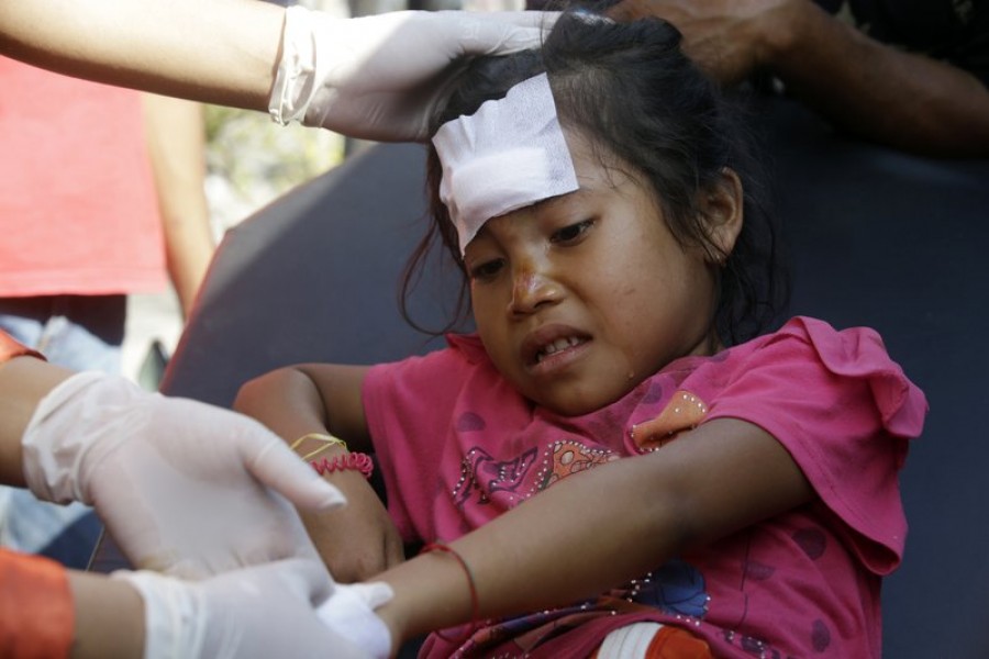 A girl injured in an earthquake is treated in Mataram, Lombok, Indonesia, Thursday, Aug. 9, 2018. The Indonesian island of Lombok was shaken by a third big earthquake in little more than a week Thursday.  - AP Photo