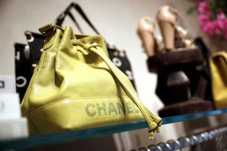 A Chanel handbag for sale is displayed at The RealReal shop, a seven-year-old online reseller of luxury items on consignment in the Soho section of Manhattan, in New York City, New York, US, May 18, 2018. Reuters/File Photo