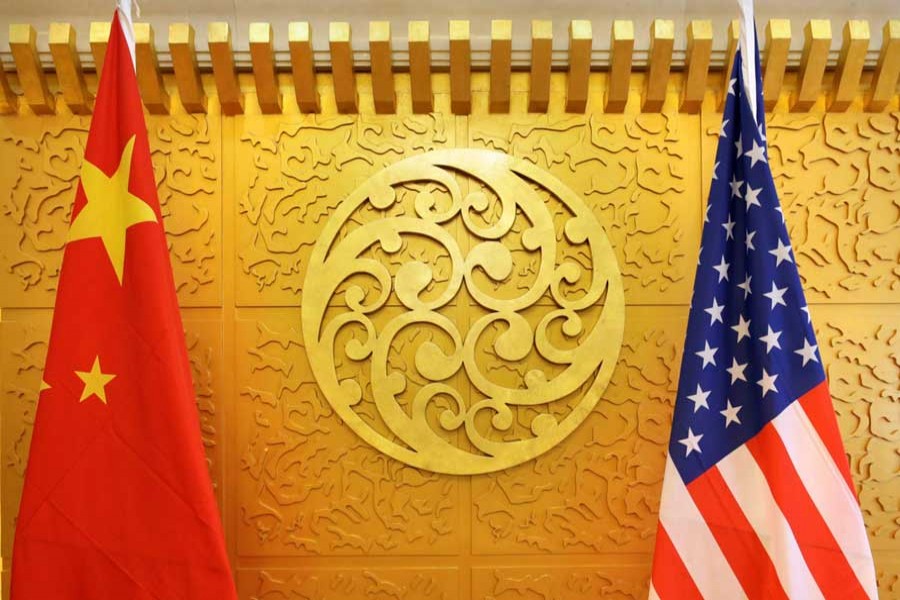 Chinese and US flags are set up for a meeting during a visit by US Secretary of Transportation Elaine Chao at China's Ministry of Transport in Beijing, China April 27, 2018. Reuters/File Photo