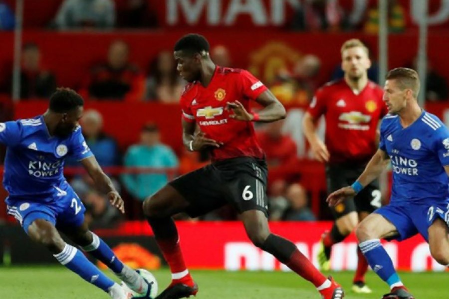 Paul Pogba in action with Leicester City's Wilfred Ndidi – Reuters photo