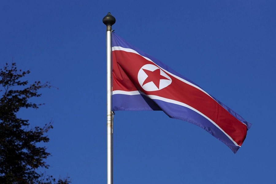 A North Korean flag flies on a mast at the Permanent Mission of North Korea in Geneva October 2, 2014 – Reuters file photo