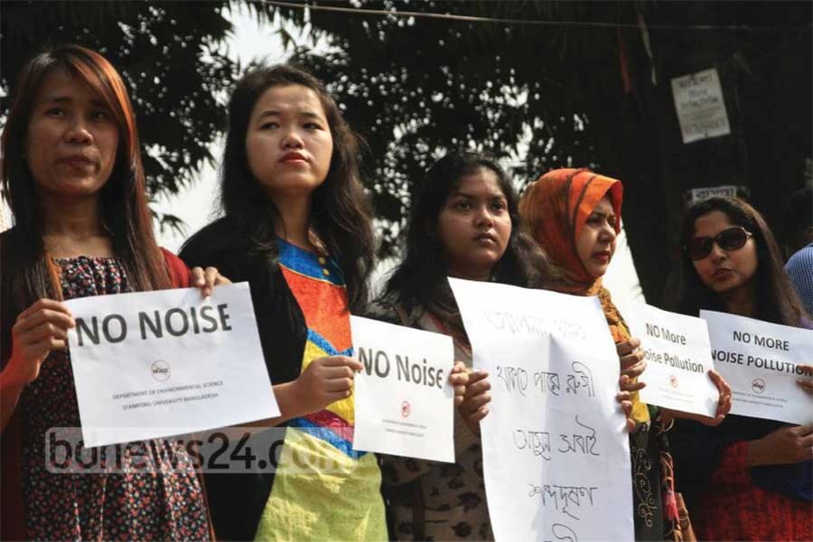 A group of students and members of several organisations demonstrate in front of the Abahani grounds in Dhaka's Dhanmondi on January 23, 2018, demanding effective action by the government against sound pollution in the name of functions after 10pm in the capital.  	—Photo: bdnews24.com