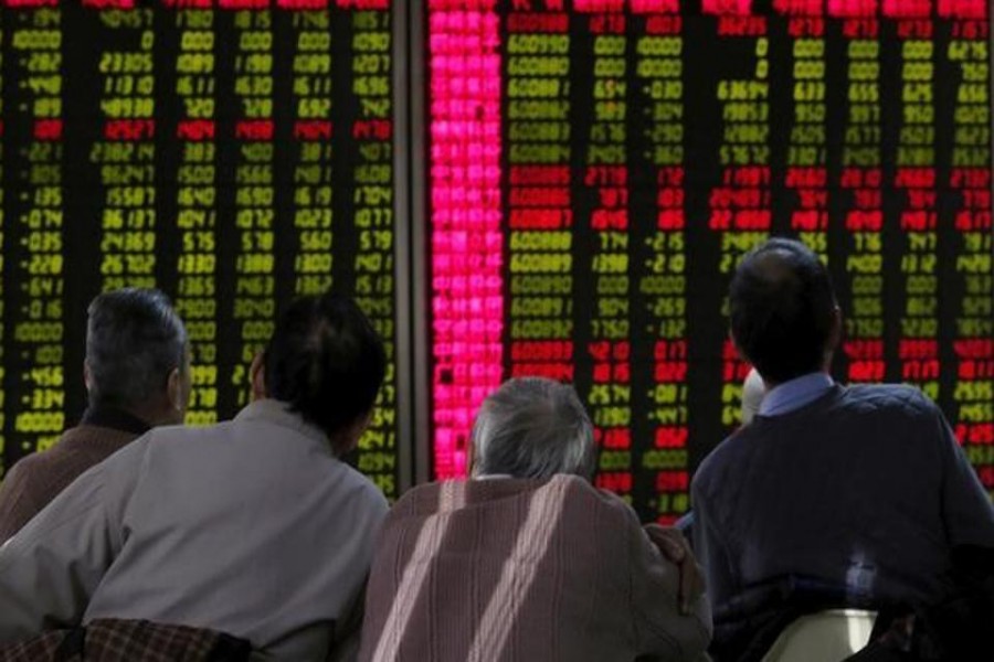 Men look at an electronic board showing stock information at a brokerage house in Beijing, China, January 5, 2016. Reuters/File Photo