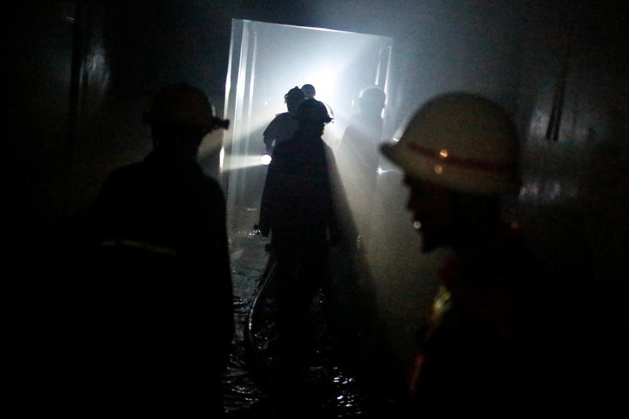 Firemen work to extinguish a fire at Yangon General Hospital, in Yangon, Myanmar on Monday — Reuters