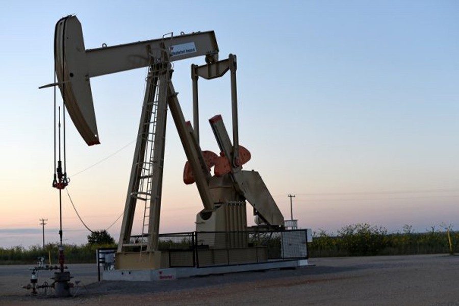 A pump jack operating at a well site leased by Devon Energy Production Company near Guthrie, Oklahoma	— Reuters