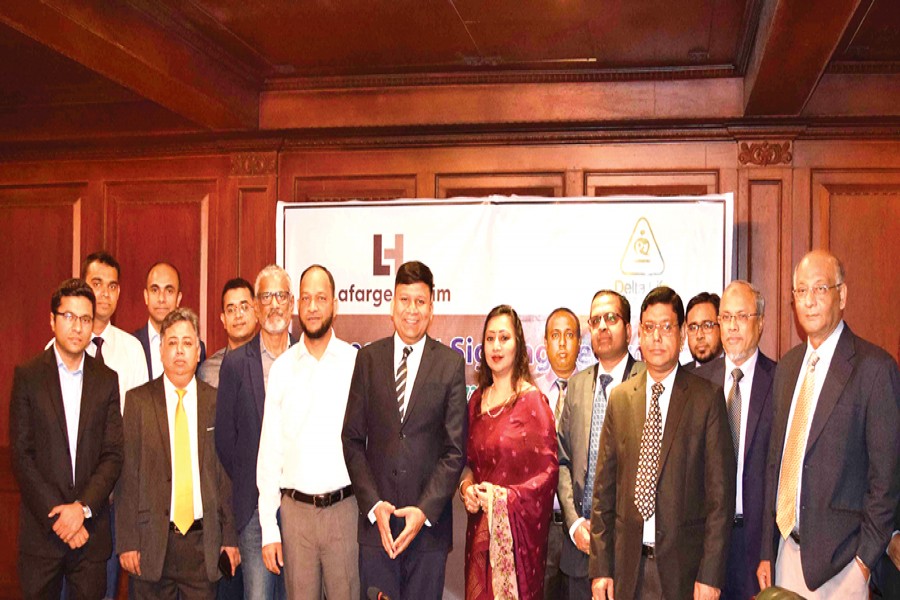 Rajesh K Surana, Chief Executive Officer, LafargeHolcim Bangladesh Limited and Ms. Adeeba Rahman, ACII (UK), Chief Executive Officer, Delta Life Insurance Company Limited seen in the  agreement signing ceremony
