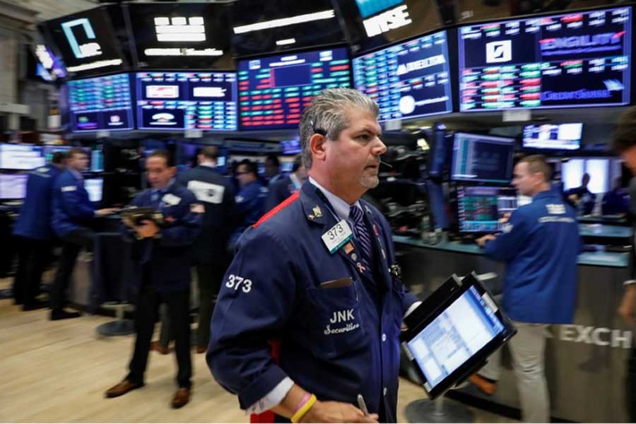 Traders work on the floor of the New York Stock Exchange (NYSE) in New York, US, July 16, 2018. Reuters