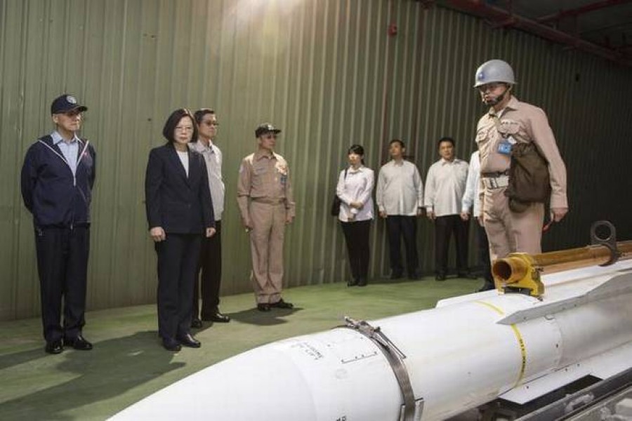 In this file photo, Taiwan's President Tsai Ing-wen, second from left, listens to a brief on a missile at Su'ao naval station during a navy exercise in the northeastern port of Su'ao in Yilan County, Taiwan.  –AP