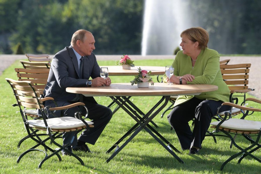 Russian President Vladimir Putin holding talks with German Chancellor Angela Merkel during their meeting at the German government guest house Meseberg Palace in Gransee, Germany on Saturday	— Reuters