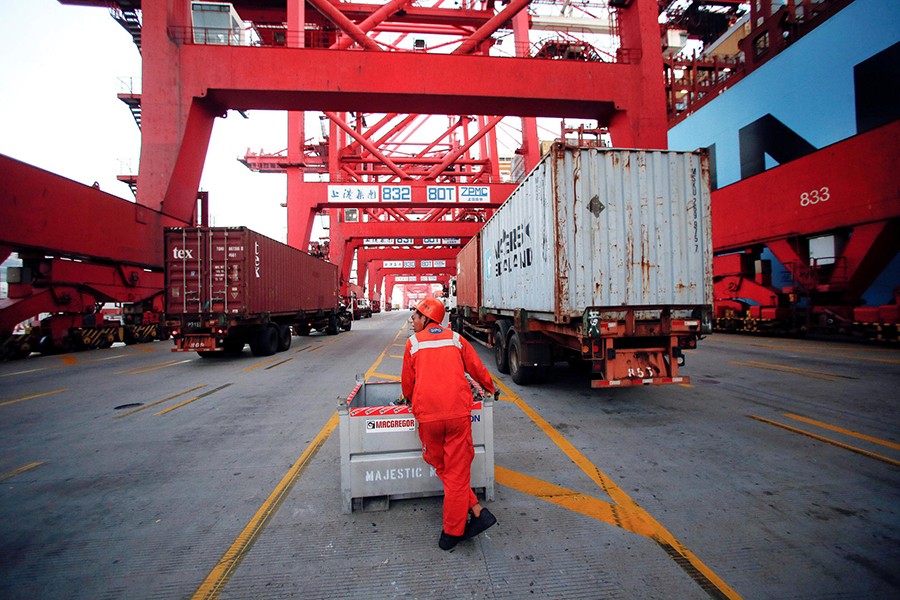 A worker is seen at the Yangshan Deep Water Port, part of the Shanghai Free Trade Zone, in Shanghai, China on September 24, 2016 — Reuters/File