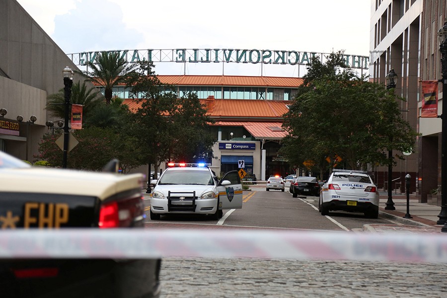 Police officers cordon off a street outside The Jacksonville Landing after a shooting during a video game tournament in Jacksonville, Florida on Sunday — Reuters photo