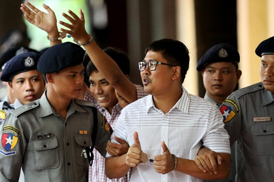 Detained Reuters journalists Wa Lone and Kyaw Soe Oo arrive at Insein court in Yangon, Myanmar on Monday — Reuters photo