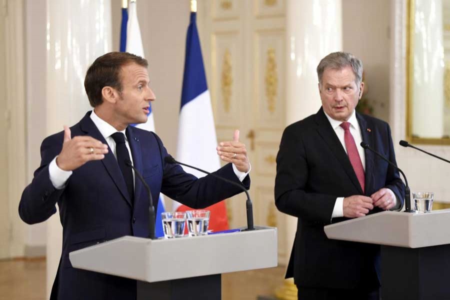 French President Emmanuel Macron and Finland's President Sauli Niinisto speak during a news conference at the Presidential Palace in Helsinki, Finland August 30, 2018. Reuters