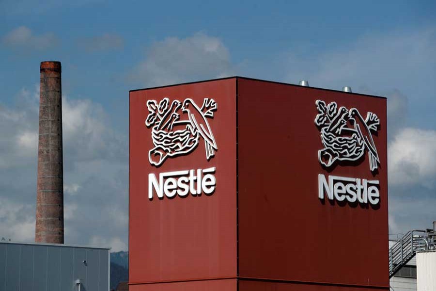 A Nestle logo is pictured on a coffee factory in Orbe, Switzerland May 31, 2018. Reuters/Files