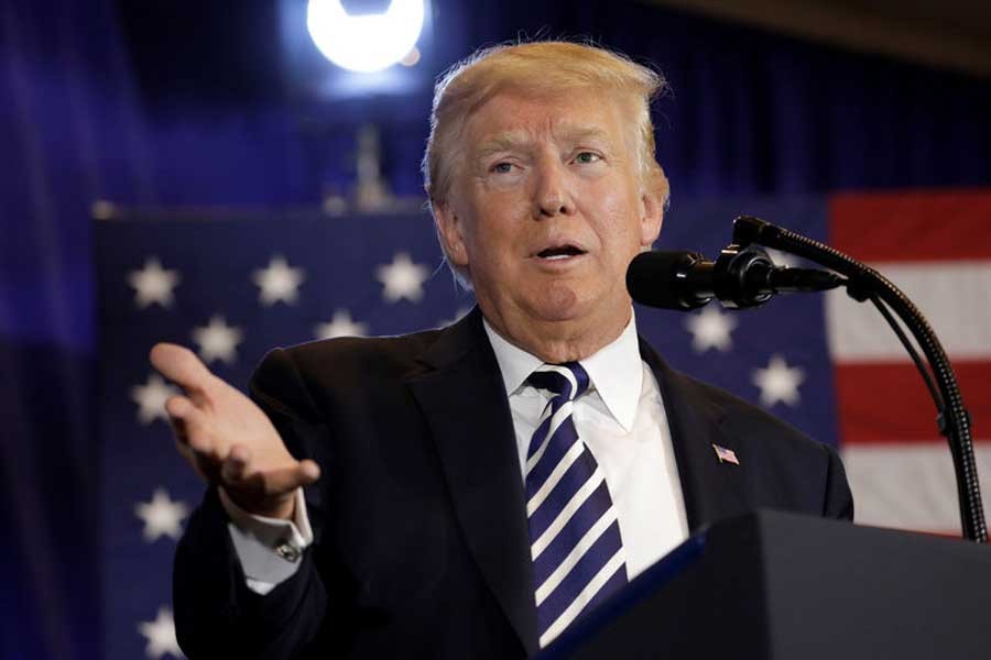 US President Donald Trump delivers remarks before signing an executive order on strengthening retirement security in America at Harris Conference Center in Charlotte, NC, US, August 31, 2018. Reuters/Files