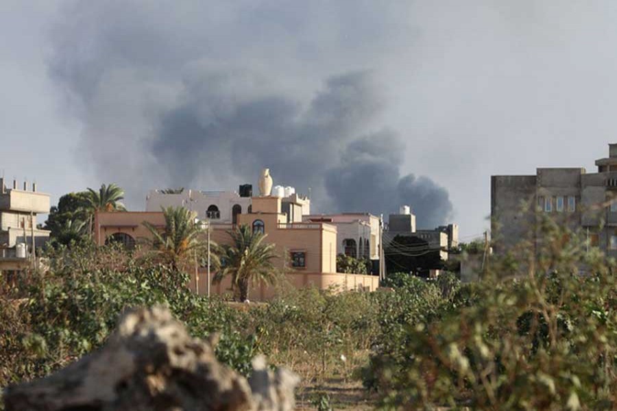 Smoke rises during heavy clashes between rival factions in Tripoli, Libya, August 28, 2018. Reuters