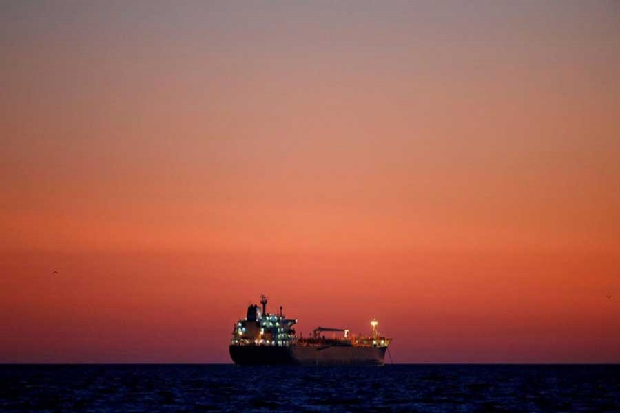 An oil tanker is seen at sunset anchored off the Fos-Lavera oil hub near Marseille, France, October 5, 2017. Reuters/File Photo