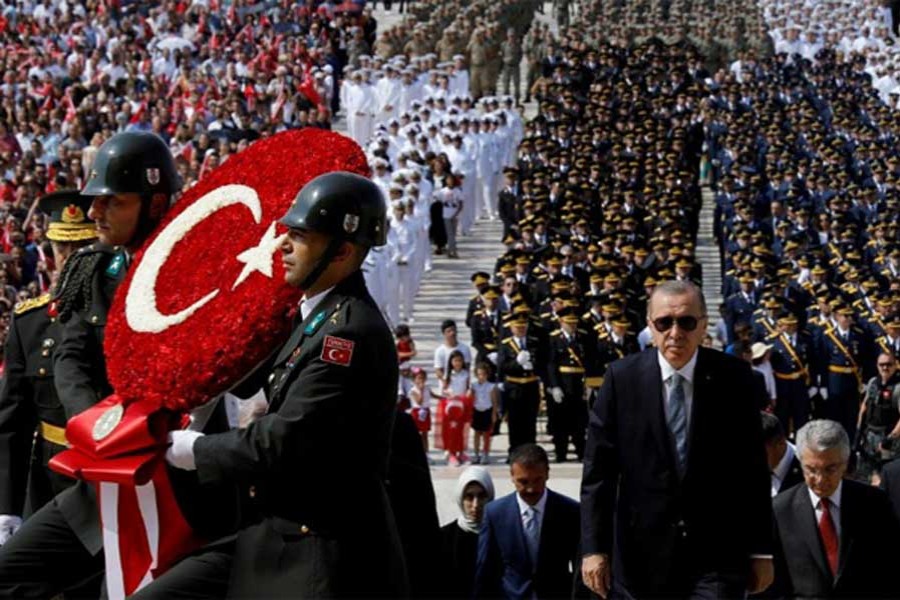 In this file photo, Turkish President Tayyip Erdogan attends a ceremony marking the 96th anniversary of Victory Day at the mausoleum of Mustafa Kemal Ataturk in Ankara, Turkey.