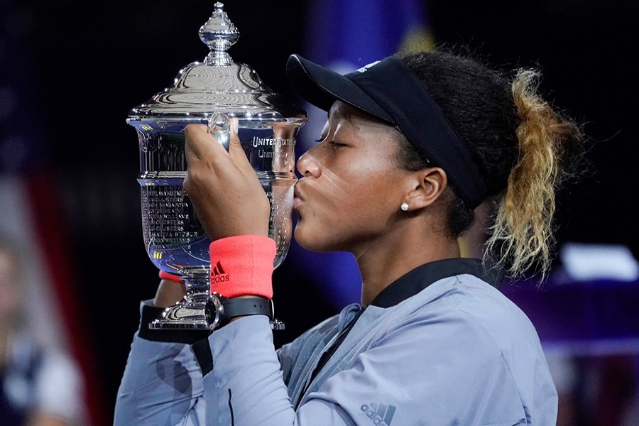 Naomi Osaka of Japan kisses the US Open trophy after beating Serena Williams of the USA in the women’s final of the 2018 US Open tennis tournament on Saturday — USA Today Sports via Reuters