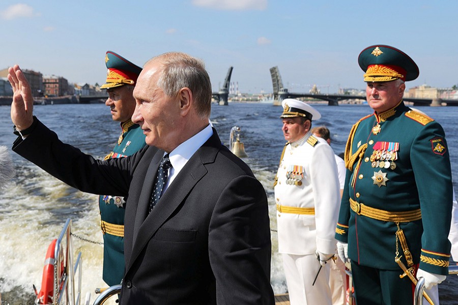 Russian President Vladimir Putin, Defence Minister Sergei Shoigu and Commander of Western military district Colonel-General Andrei Kartapolov attend the Navy Day parade in St. Petersburg, Russia on July 29 last 2018 — Reuters/File