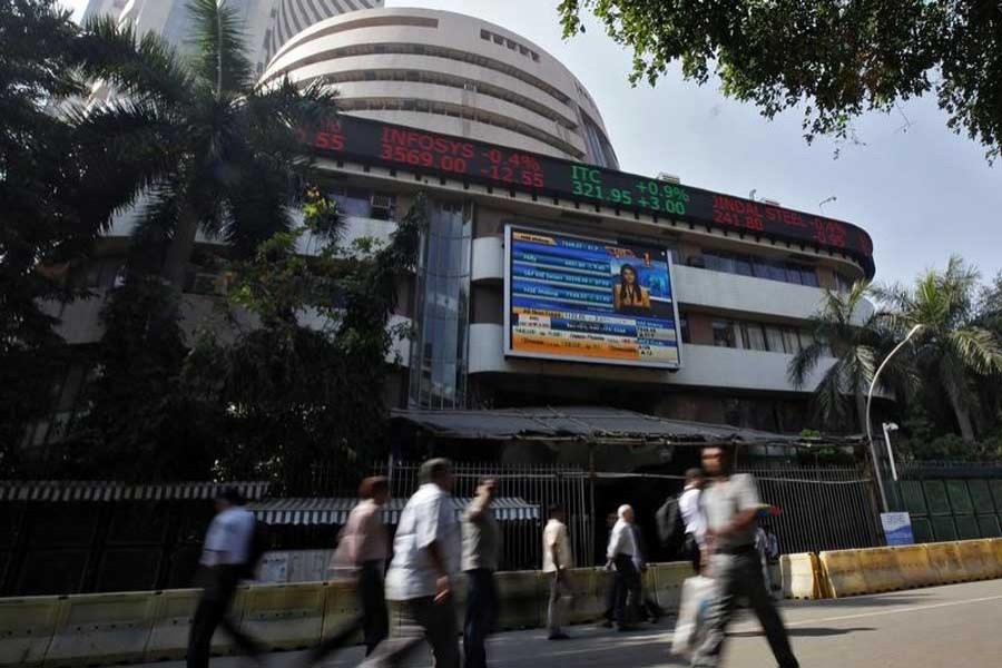 Indian shares tick higher; rupee falls
