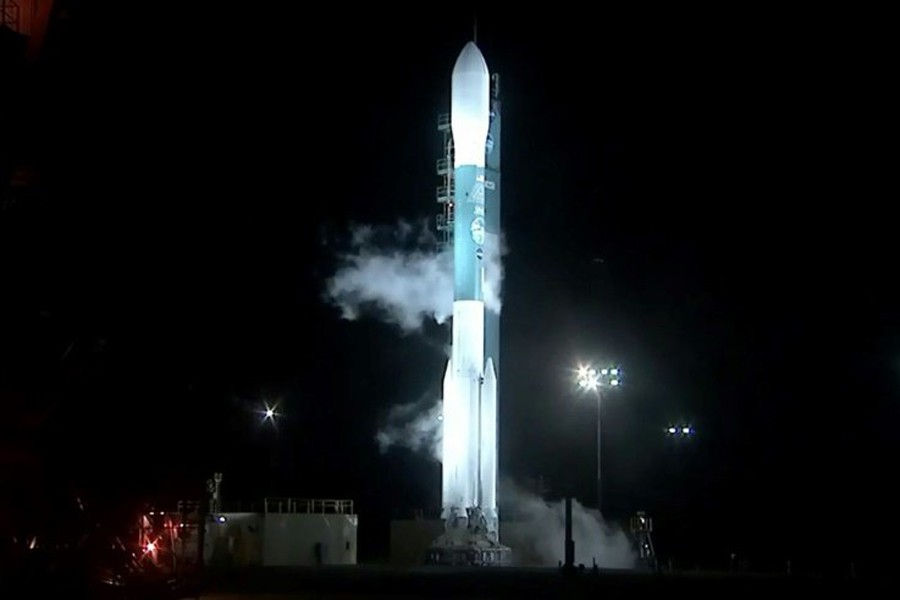 The Delta II rocket waits on the service tower for takeoff. Internet photo